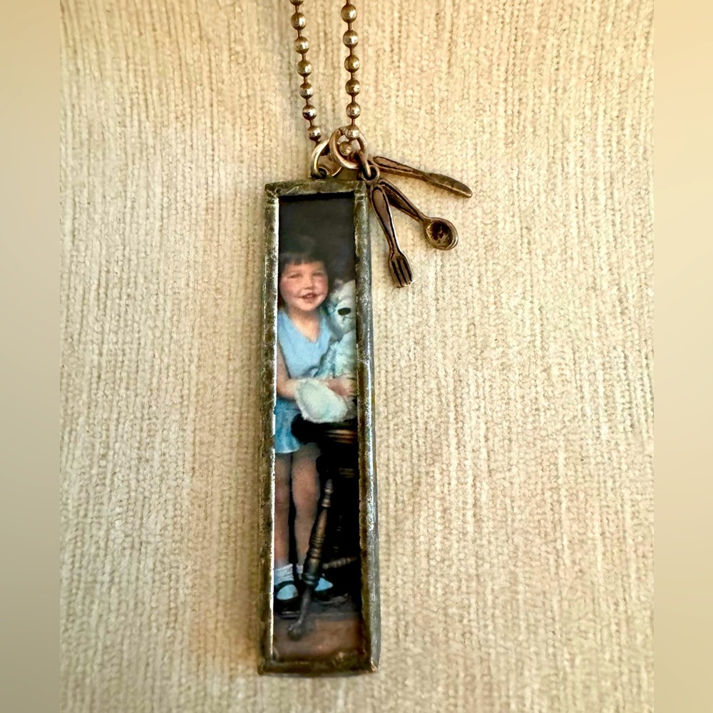 Vintage inspired long silver photo pendant.